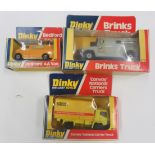 Three boxed Dinky Toys vehichles to include a Brinks Truck, a Bedford AA Van and a 'Convoy' National