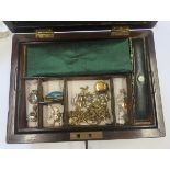 A rosewood jewellery box with brass inlay and key containing a collection of early 20th century