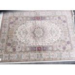 A new beige ground keshan style carpet decorated with medallions and flora 2.3m x 1.6m