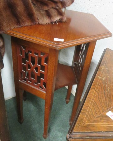 A mahogany hexagonal two tiered occasional table