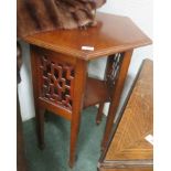A mahogany hexagonal two tiered occasional table