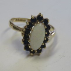 A marked 9ct gold opal and sapphire cluster ring, ring size N ½, weight 2.4g