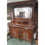 A mahogany sideboard with mirrored back