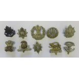 10 Army cap badges including bronzed officers East Surrey RGT etc.