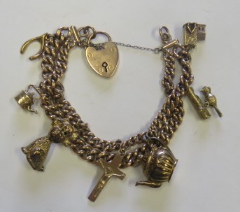 A marked 9ct rose gold curb chain charm bracelet, with rose gold heart padlock, most charms marked