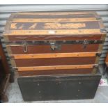 A Domed Leather and Wood trunk together with another trunk