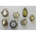 Seven watch heads to include yellow and white metal