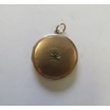 A diamond star set marked 9ct gold front and back circular photograph locket, measuring 2.4cm in
