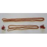 Two long coral type necklaces, measuring 110cm and 140cm, weight 94.6g, together with a pair of