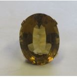 A marked 9ct gold citrine cocktail ring set with a large faceted oval citrine measuring 25.5mm x