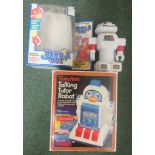 A boxed Tomy Talking Tutor Robot together with a boxed Benda Bot