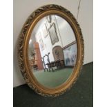 Oval gilded framed mirror (some damage to frame) together with a print of Outside the Vaudeville