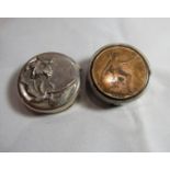 A marked 925 silver pill pot with a floral embossed lid measuring 3.4cm in diameter together with