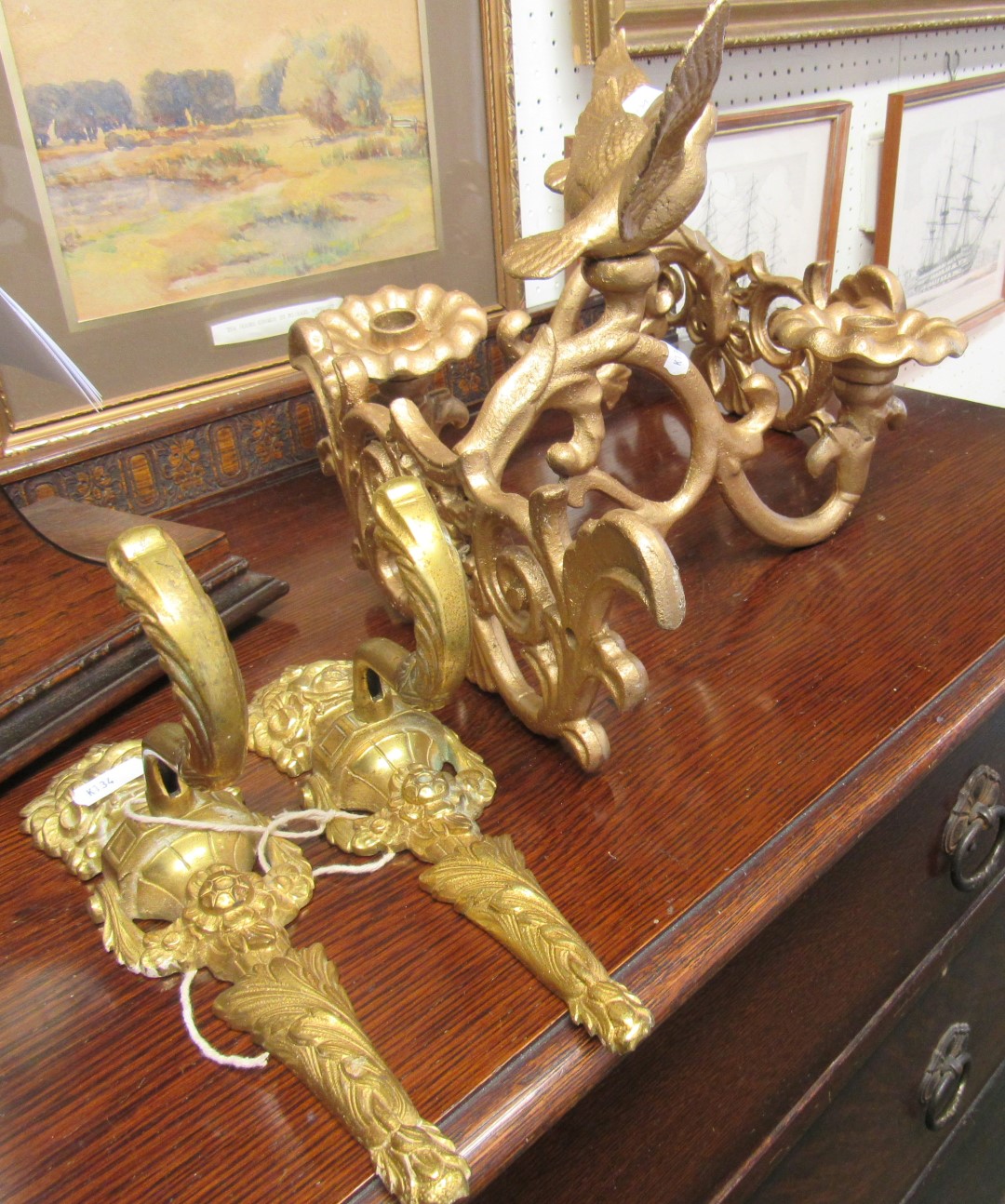 1 pair of cast iron bird mounted candle holders with a pair of wall light holders.