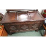 Antique 18th century oak coffer with plain panel top and three panel with rosette carved front.