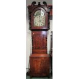 A Victorian large long case clock in flame mahogany. 239cm high x 65cm. 8 day movement, painted dial