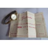 A boxed 1961 Smiths Empire wrist watch with gold edging to the dial and gold plated bracelet strap