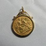 A 1909 gold sovereign with a scroll pendant suspender and mount (mount marked 375) Gross weight 9.