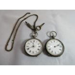 A marked fine silver open faced pocket watch with foliate scroll decoration to the case and blank