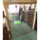 Large antique over mantel mirror, wooden frame painted in gilt. Left foot missing. 136cm x 110cm