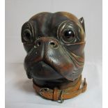 A Victorian wooden bulldog inkwell with glass inserted eyes and hinged head enclosing a brass