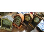 A Victorian timepiece and three other mantel clocks