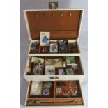 A jewellery box containing vintage and modern costume jewellery and hat pins