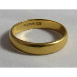 A 22ct gold band ring, faded hallmark, ring size M, weight 3.7g.