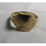 A marked 375 gold signet ring with vacant panel and floral engraved corner. Ring size Z, weight 4.