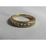 A 18 gold, platinum and diamond half eternity band ring, faded marking. Ring size M, weight 3.6g