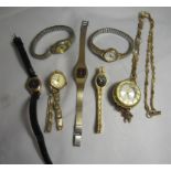 A decorative ladies pocket watch on a necklace chain together with six ladies wristwatches.