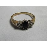 A 9ct gold sapphire and diamond accented dress ring, with faded hallmark, ring size O, weight 2.2g