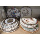 A mixed collection of attractive decorative plates