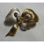 A marked 750 yellow and white gold diamond accent bow brooch, length at longest point 4.5cm,