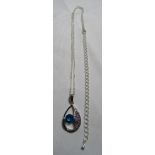 A white metal necklace set with amethysts and a blue topaz (?)