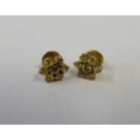 A pair of gold and yellow sapphire flower head stud earrings, diameter approx 11mm, weight 4.4g.