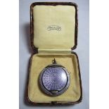 A silver and mauve guilloche deep mirrored compact, adapted for pendant wear, hallmarked for