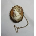 A 9ct gold cameo brooch measuring 3.7cm in length with an applied rope twist surround, hallmarked