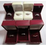 A collection of seven marked 925 white stone rings to include two marked DIA and one marked CZ,