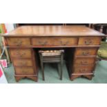 A pedestal desk wih three drawers to each pedestal and three drawers to top with leather insert