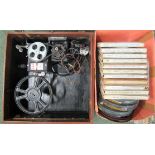 A Pathescope 'Ace' circa 1930's 9.5mm projector in its leather type case together with 16 reels