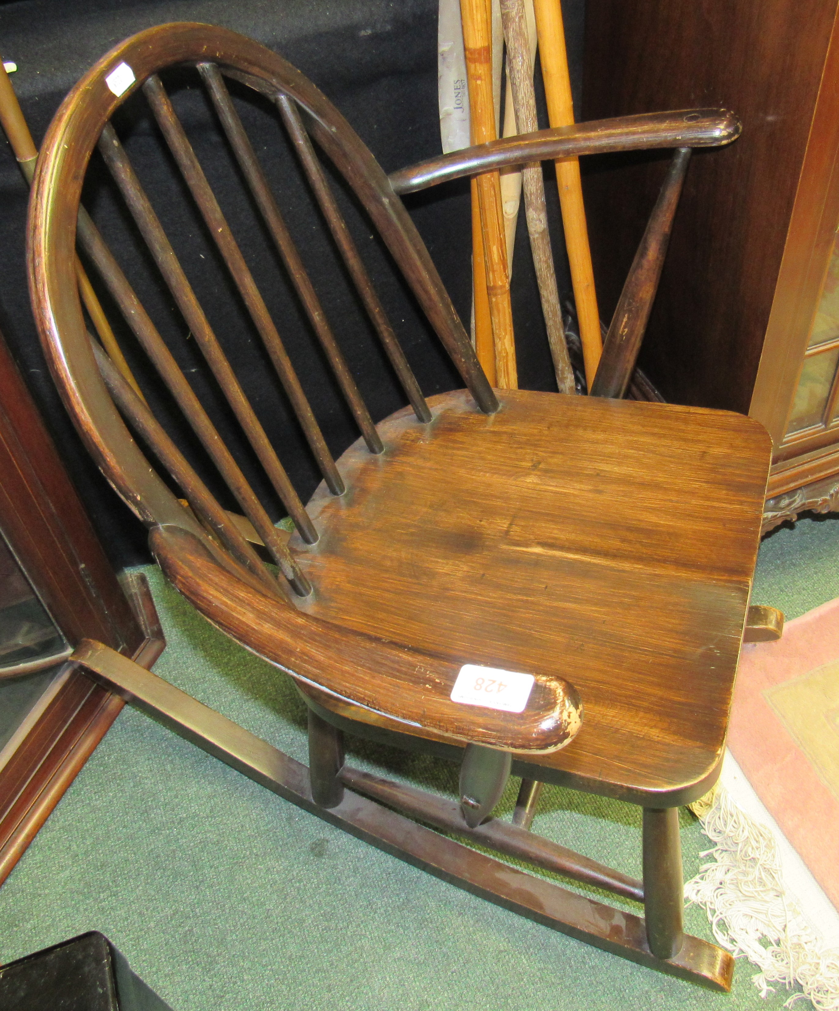 A child's Ercol wooden rocking chair (AF)