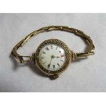 A late 19th/early 20th century ladies gold cased wristwatch (inner case marked 9C and 9.375) with