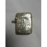 A silver vesta case with foliate scroll engraving, hallmarked for Birmingham 1904, measurement - 5cm