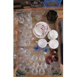 A box of crystal glasses including sherry and champagne, two Duiske candlesticks with blue glass