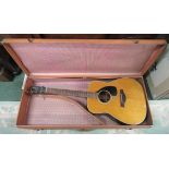 A cased Yamaha Guitar FG180