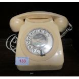 Plastic telephone with manual numbered dial