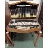 A canteen table containing silver and stainless steel cutlery/flatware. Marked Winslade, Fore