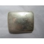 A silver cigarette case of plain form with name engraved to the lid, hallmarked for Chester 1908.