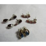 A pair of 9ct gold, topaz and alexandrite earrings, stud backs with the pear shape earring length